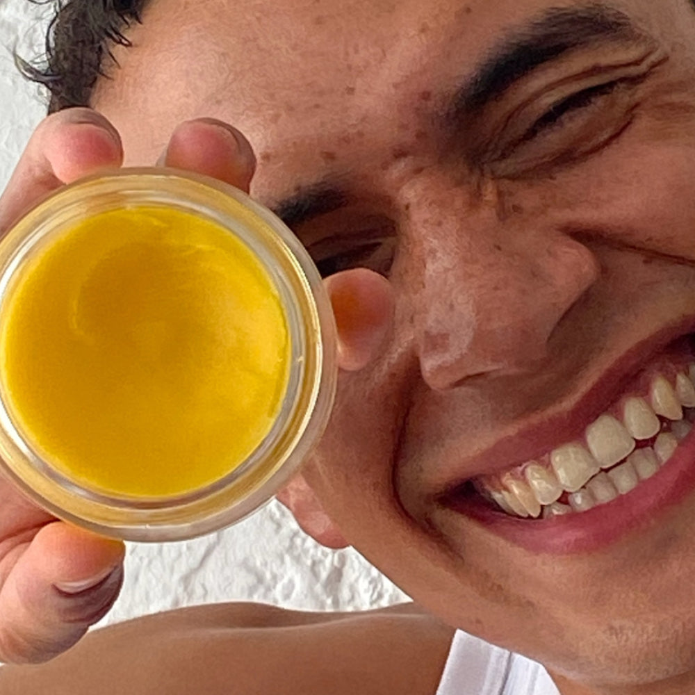 Model holding Active Collagen Wonder Cleansing Balm