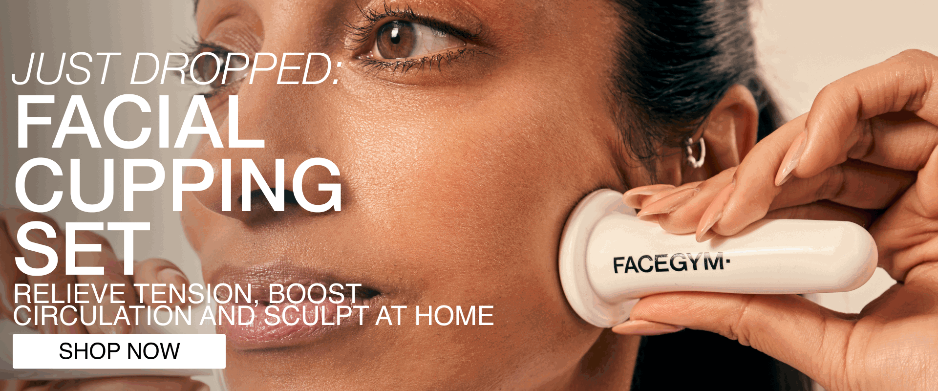 a woman using a face massager