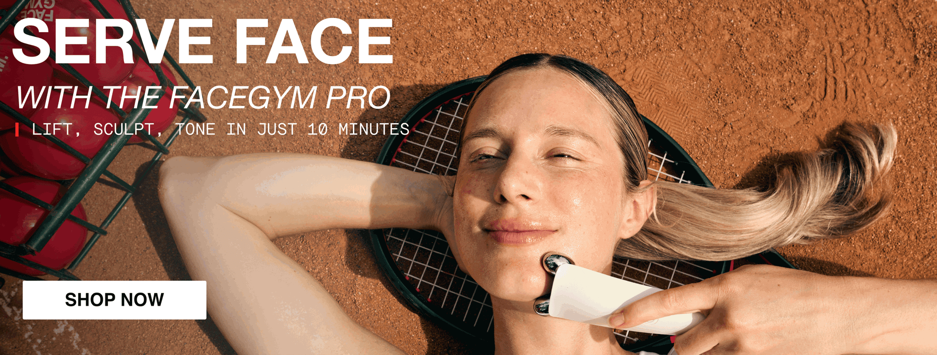 a woman lying on the ground with a tennis racket
