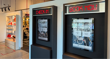 a two black rectangular boxes with red lit up signs