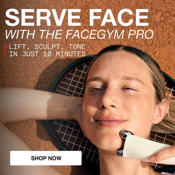 a woman lying on the ground with a tennis racket