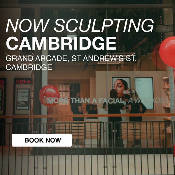 a window with a sign and balloons